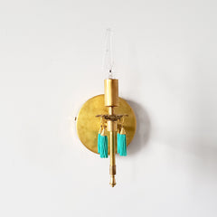 Brass wall sconce with turquoise beaded tassels