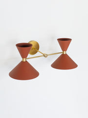 terra cotta brown and brass two light bathroom wall sconce with mid century modern cone shades