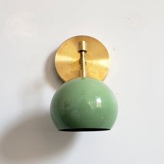 pale green and brass midcentury modern inspired globe wall lighting sconce