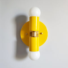 Yellow and Brass two light wall sconce