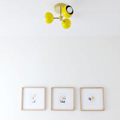 yellow and brass mid century modern three light flushmount ceiling fixture