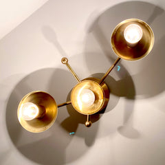 Lit up star inspired wall sconce