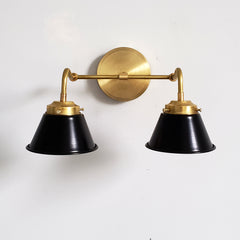 Black and brass modern wall sconce perfect for bathroom vanity lighting.  This black and gold two light wall sconce in made in New Orleans