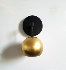 black and brass gold wall sconce modern art deco mid century modern luxury lighting wall sconce beside lamp