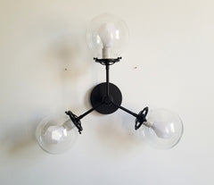 black ceiling light with clear globes