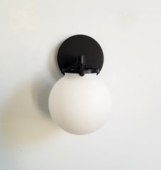 Black and white Jones wall sconce glass globe bathroom vanity lighting modern minimalism