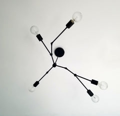 Black modern asymmetric chandelier lighting mid century organic design home renovation dining room