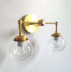 two light wall sconce brass and clear lighting