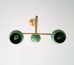 light green and gold brass mid century inspired periscope chandelier lighting fixture with globe shades