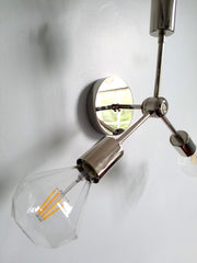 detail of chrome wall sconce or flushmount light fixture