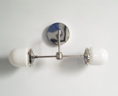 chrome and white wall sconce bathroom