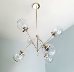 chrome and clear glass modern angular chandelier light fixture for traditional meets modern home renovation