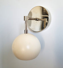 cream and chrome wall sconce