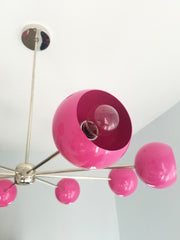 bright pink fuscia and chrome modern eyeball shade italian midcentury inspired nursery decor bright lighting colorful design contemporary modern minimalism