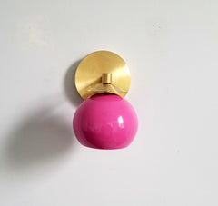 bright pink and brass mid century inspired wall sconce task lighting