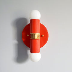 orange-red poppy red  and Brass two light wall sconce or flush mount ceiling light fixture in a bright vibrant color and mid century modern or art deco design