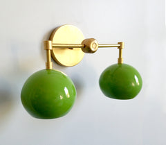 spring green and brass two-light bathroom lighting mid-century inspired