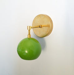 brass and green mid century modern inspired wall sconce
