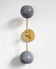 grey and brass midcentury modern inspired accent lighting wall sconce globe shades
