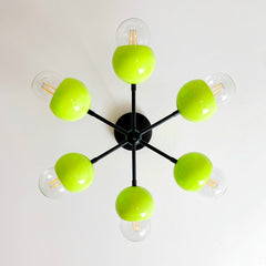 Neon Chartreuse and matte black mid century modern meets post modern wall light fixture by sazerac stitches