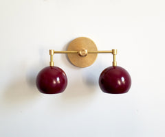 brass and maroon two-light modern wall sconce bathroom lighting