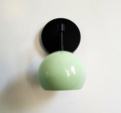 Mint and matte black single light wall sconce with a globe shade midcentury modern minimalism vanity task lighting