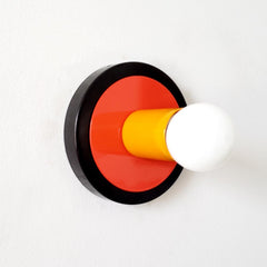 sconce with different shades of orange and black.  Midcentury modern pop-art inspired sconce or ceiling light fixture