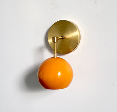 brass and orange mid century modern wall sconce accent lighting