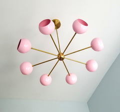 MCM inspired lighting in brass and pink nursery decor modern lighting
