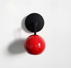 red and black mid century modern wall sconce eyeball globe shade accent lighting