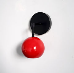 red and black mid century modern wall sconce eyeball globe shade accent lighting