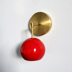 red and brass mid century modern globe wall sconce