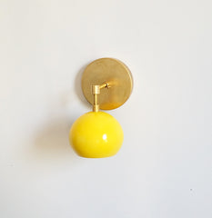yellow and brass home decor lighting sconce