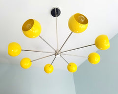 yellow and chrome modern eyeball shade italian midcentury inspired nursery decor bright lighting colorful design contemporary modern minimalism