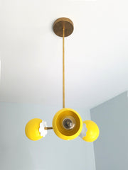 yellow and brass flower chandelier children's bedroom