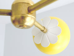 yellow and brass flower chandelier childrens bedroom